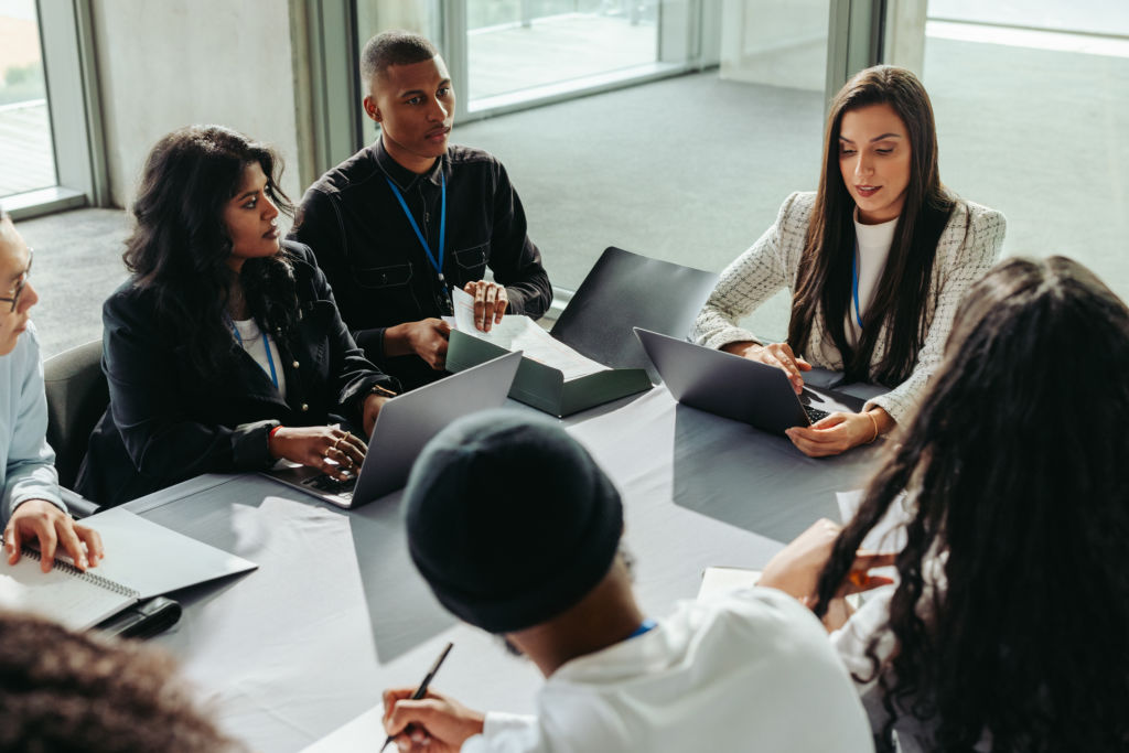 Business team discussing work processes in an office meeting